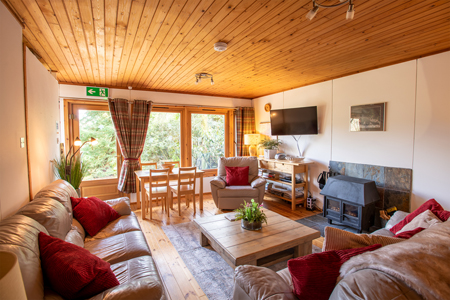 Lounge with log burner at Self Catering Chalet Salen Ardnamurchan Scotland