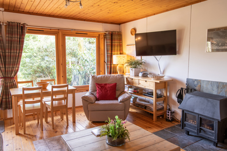 Lounge with log burner at Self Catering Chalet Salen Ardnamurchan Scotland